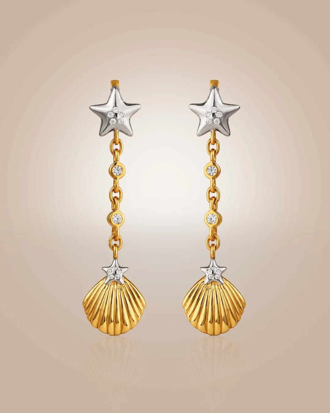 925 silver 22K gold vermeil & rhodium drop earrings; starfish & seashell motifs with CZ, anti-tarnish on beige.
