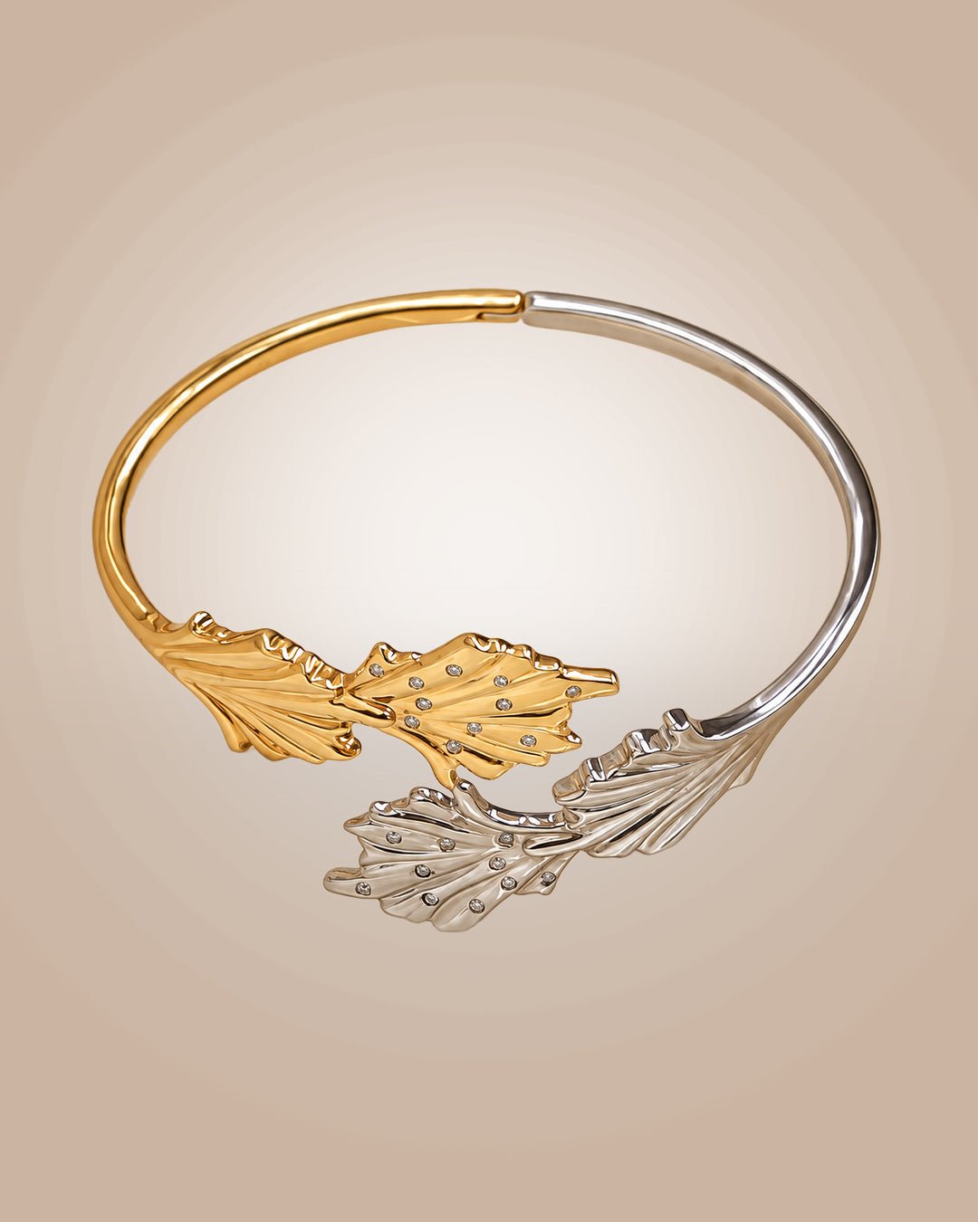 925 sterling silver bypass cuff bracelet with 22K gold vermeil and rhodium plating, featuring coral reef-inspired motifs with paved CZ accents and an anti-tarnish finish on a warm beige background.