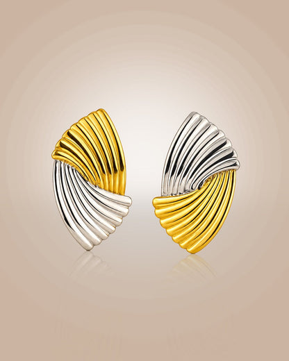 Dual-tone 925 silver 22K gold vermeil & rhodium Sangam Studs; mismatched, anti-tarnish, daily wear on beige background.