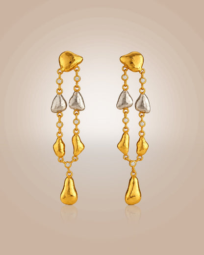 Sterling silver 22K gold vermeil & rhodium danglers; hammered oyster shell with CZ, anti-tarnish on beige background.