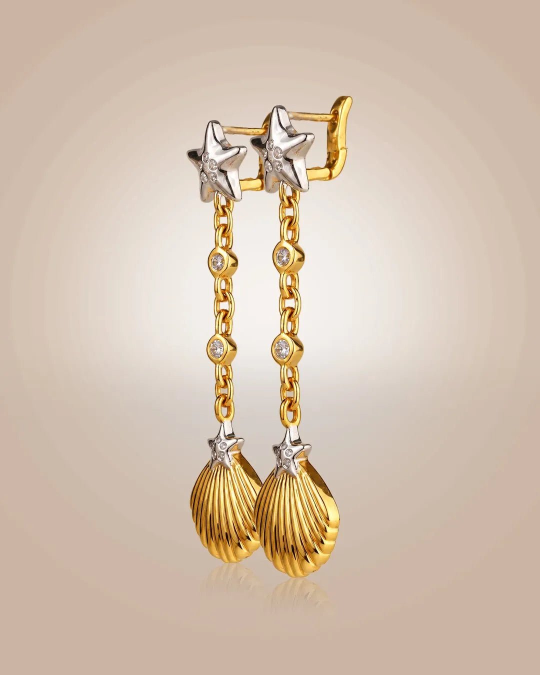 925 silver 22K gold vermeil & rhodium drop earrings; starfish & seashell motifs with CZ, anti-tarnish on beige.