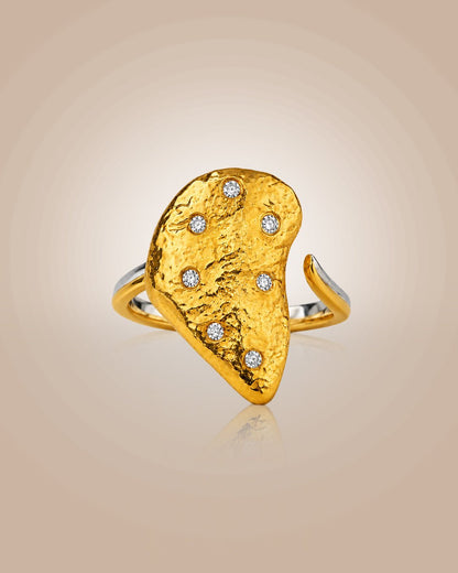 Sterling silver 22K gold vermeil & rhodium adjustable ring; hammered oyster shell motif, anti-tarnish on beige background