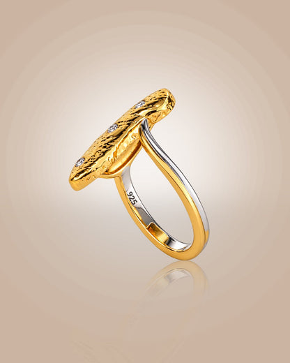 925 silver 22K gold vermeil & rhodium oyster shell ring; resort wear anti-tarnish on warm beige background.